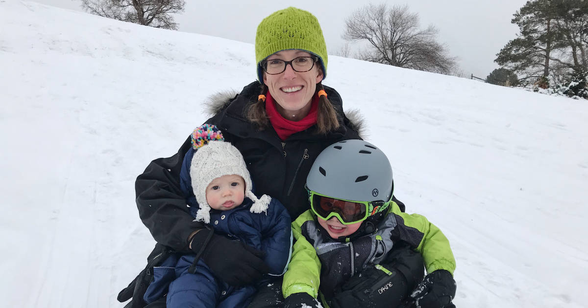 woman with kids in snow