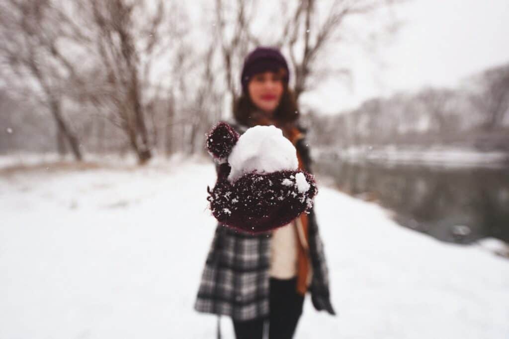 woman holding snowball