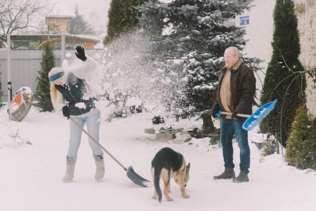 couple shoveling snow